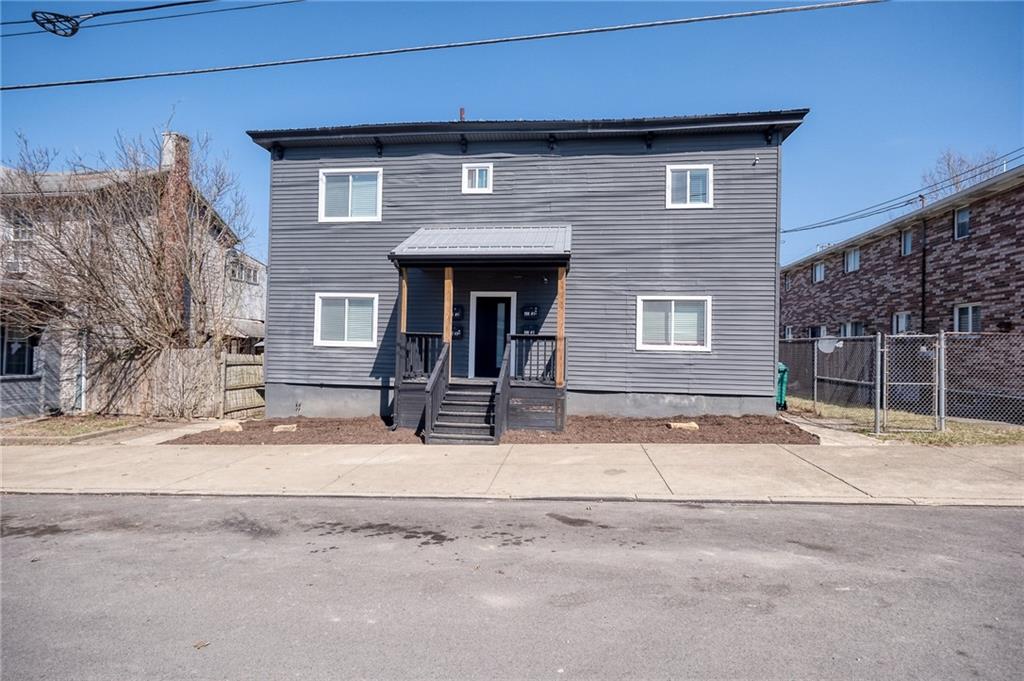 206 North Chestnut Street Derry, PA 15627 - Photo 2 of 33 a house with trees in front of it