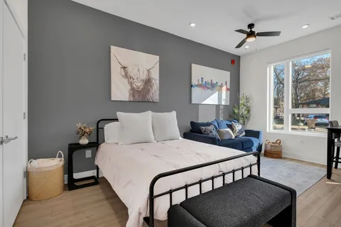 a bedroom with a bed and a table