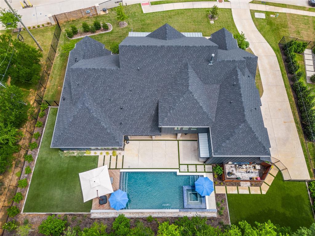 1459 Sunset Pt Drive Flower Mound, TX 75022 - Photo 34 of 38 an aerial view of residential houses with outdoor space and parking