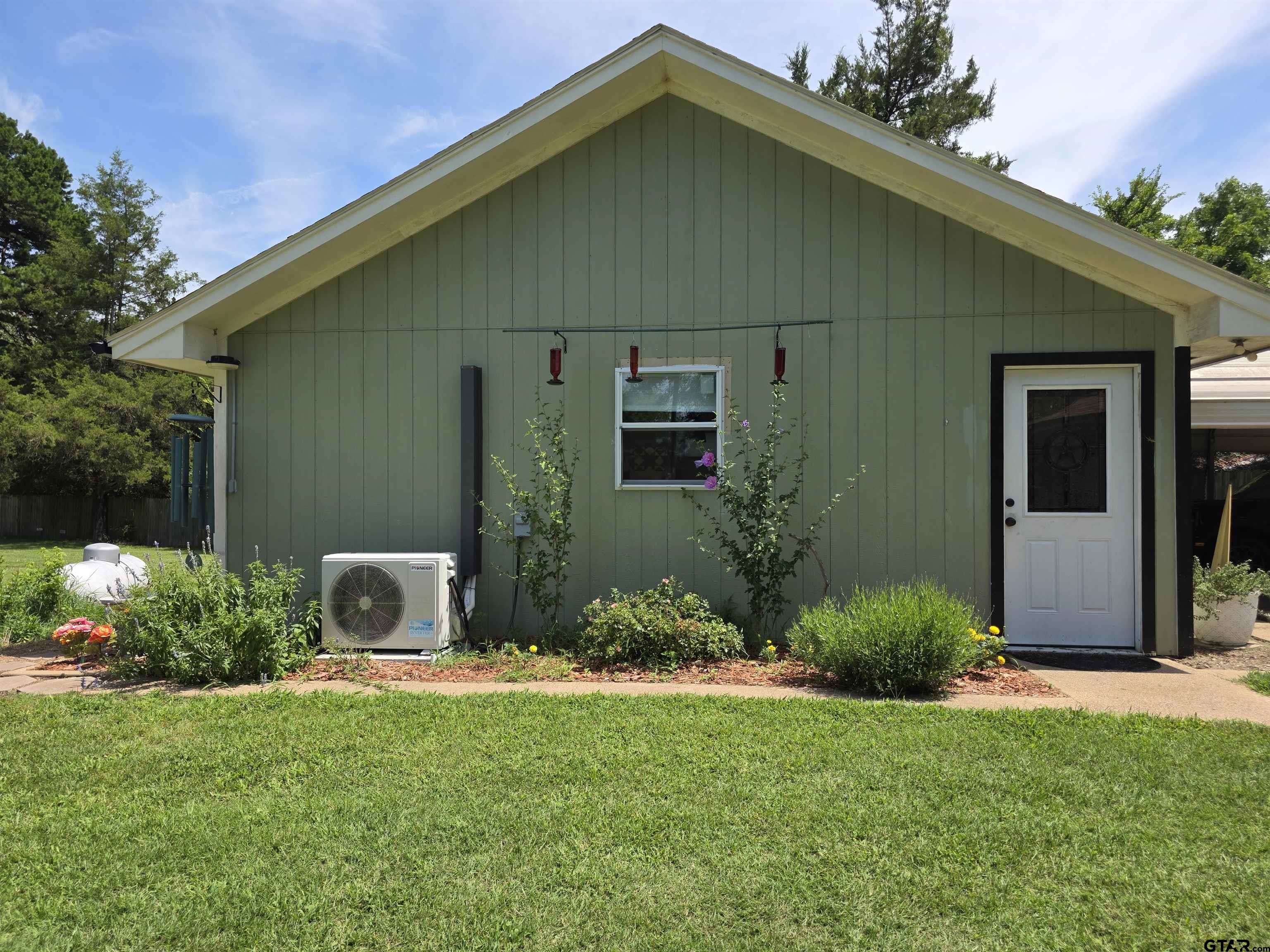 6170 Highway 271 Mount Pleasant, TX 75455 - Photo 31 of 43 a front view of a house with garden