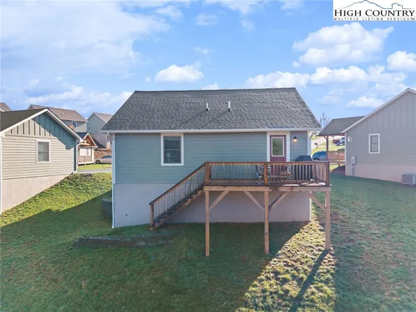 a view of a house with backyard porch and sitting area