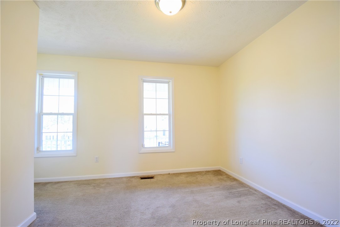 885 Ridge Road Fayetteville, NC 28311 - Photo 12 of 21 an empty room with windows