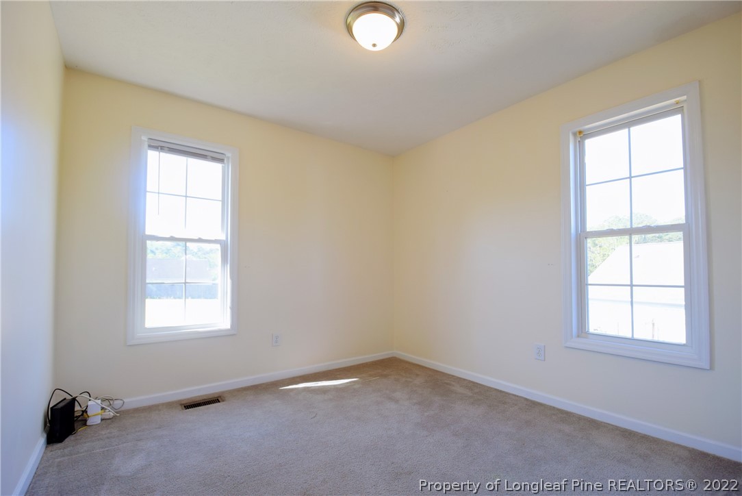 885 Ridge Road Fayetteville, NC 28311 - Photo 14 of 21 an empty room with a window