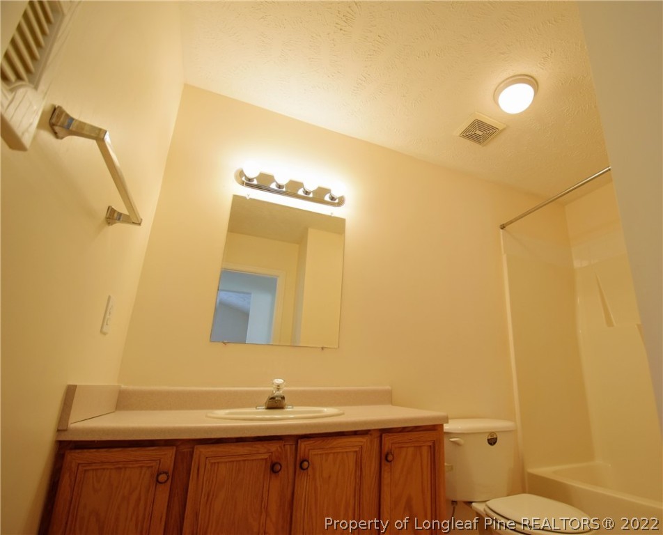 885 Ridge Road Fayetteville, NC 28311 - Photo 16 of 21 a bathroom with a sink and a mirror