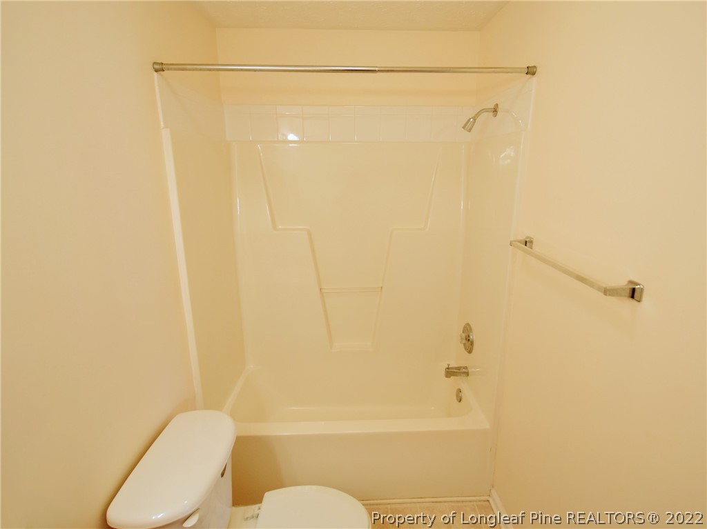 885 Ridge Road Fayetteville, NC 28311 - Photo 17 of 21 a bathroom with a shower a toilet and a sink