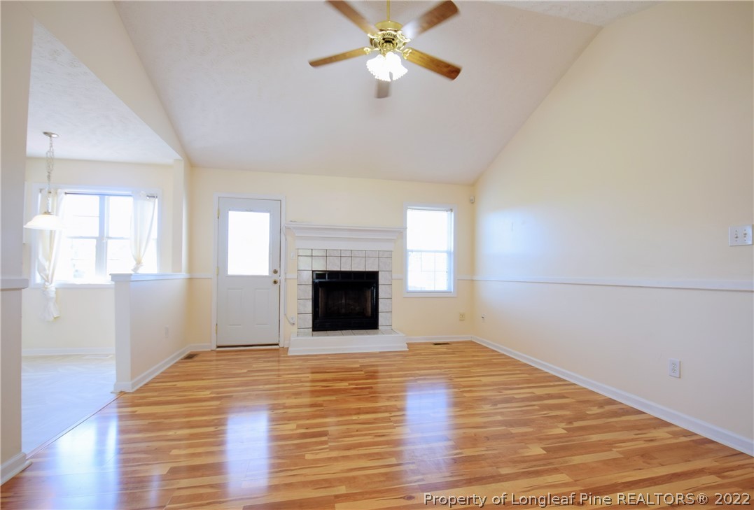 885 Ridge Road Fayetteville, NC 28311 - Photo 3 of 21 a view of empty room with wooden floor and fan