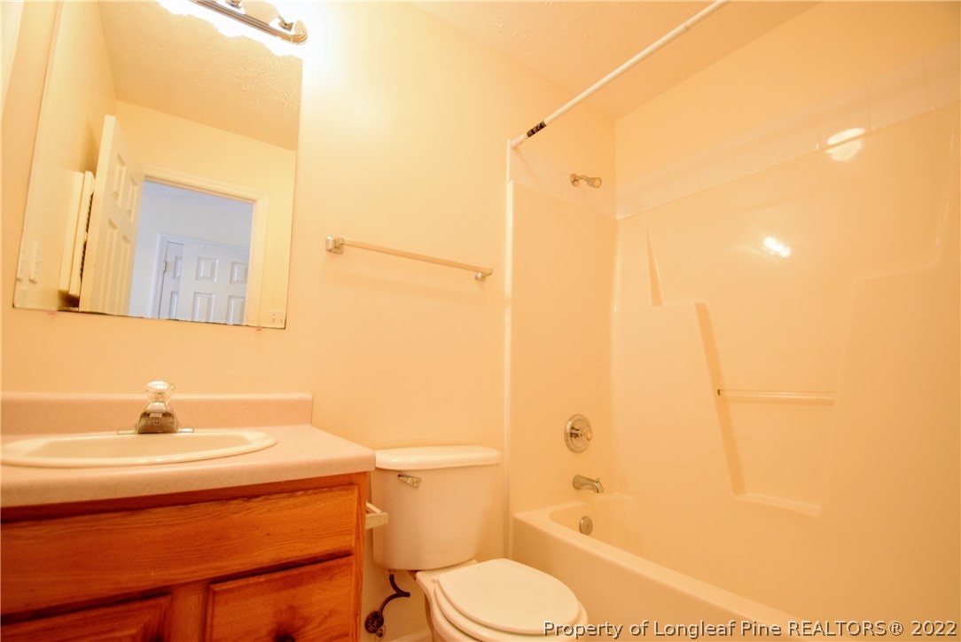 885 Ridge Road Fayetteville, NC 28311 - Photo 10 of 21 a bathroom with a sink toilet and shower