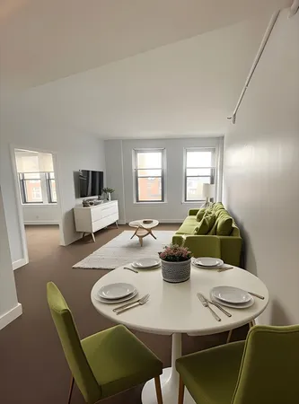 a view of a dining room with furniture
