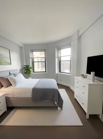 a spacious bedroom with a bed and window