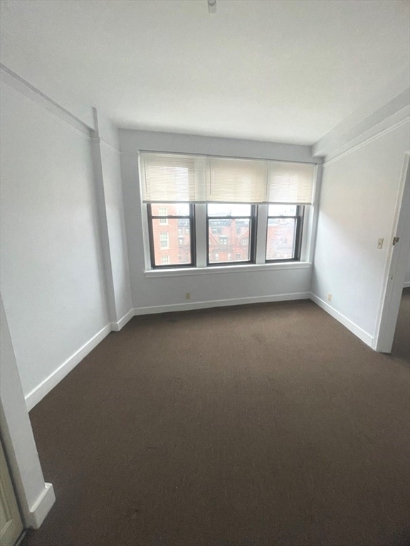 475 Commonwealth Avenue, Unit 606 Boston, MA 02215 - Photo 6 of 14 an empty room with a window