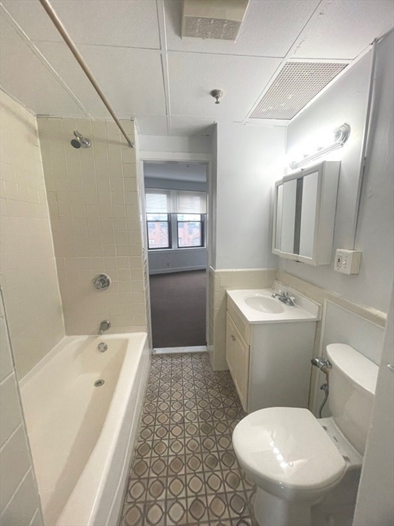475 Commonwealth Avenue, Unit 606 Boston, MA 02215 - Photo 10 of 14 a bathroom with a sink toilet and shower