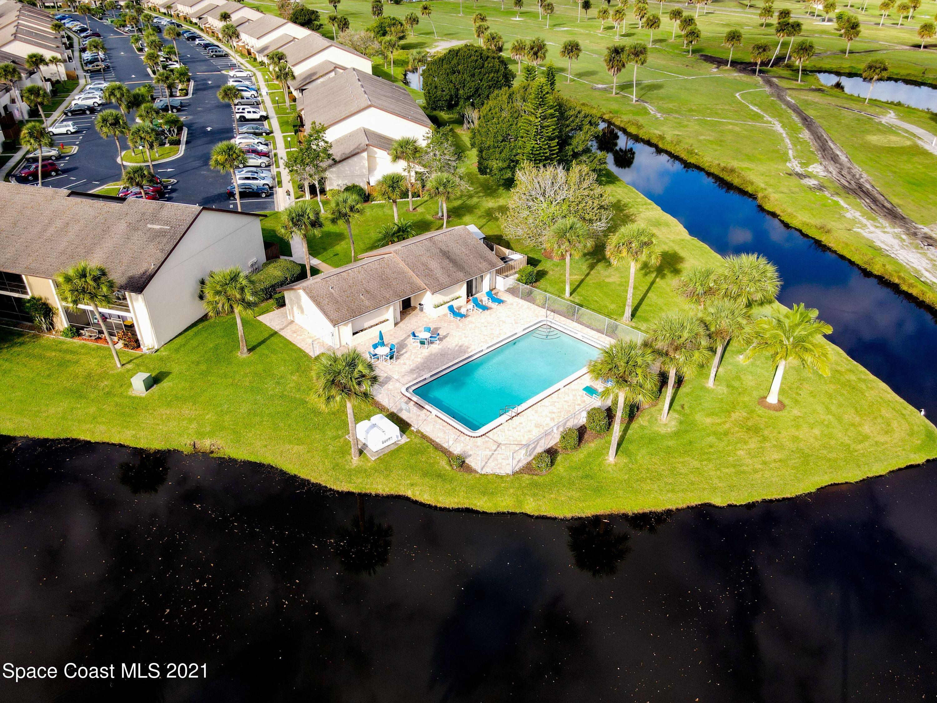 2210 Golf Isle Drive, Unit 906 Melbourne, FL 32935 - Photo 13 of 74 an aerial view of a house with yard swimming pool and outdoor seating