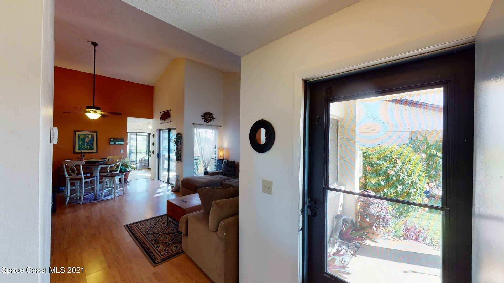 2210 Golf Isle Drive, Unit 906 Melbourne, FL 32935 - Photo 16 of 74 a living room with furniture and a window