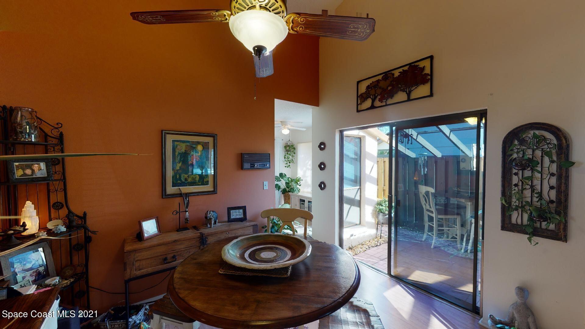 2210 Golf Isle Drive, Unit 906 Melbourne, FL 32935 - Photo 25 of 74 a room with furniture and wooden floor