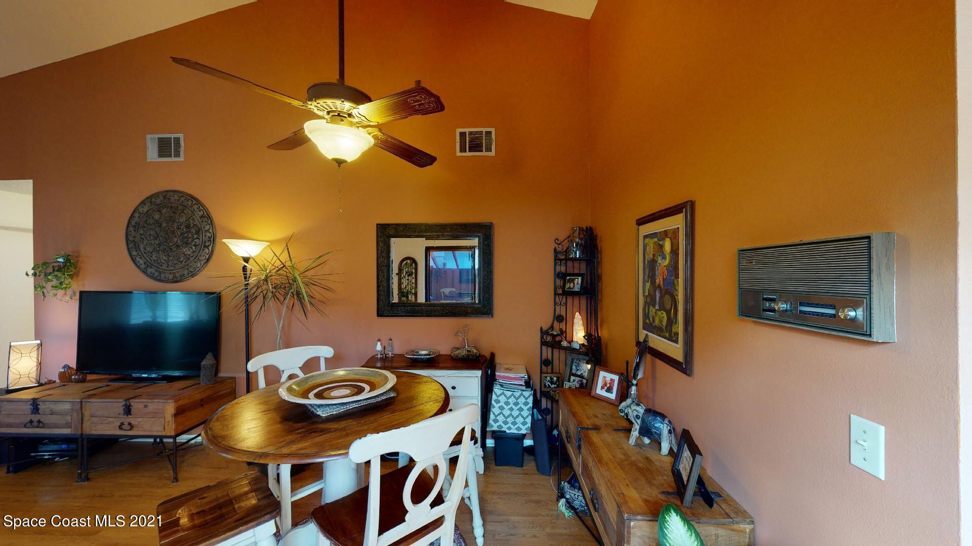 2210 Golf Isle Drive, Unit 906 Melbourne, FL 32935 - Photo 27 of 74 a view of a livingroom with furniture and a flat screen tv
