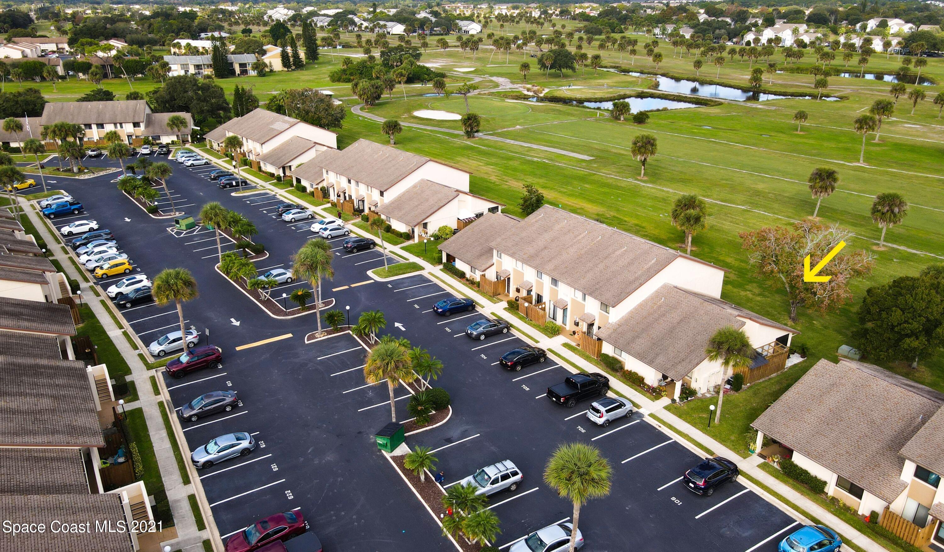 2210 Golf Isle Drive, Unit 906 Melbourne, FL 32935 - Photo 4 of 74 an aerial view of a city with lots of residential buildings ocean and mountain view in back