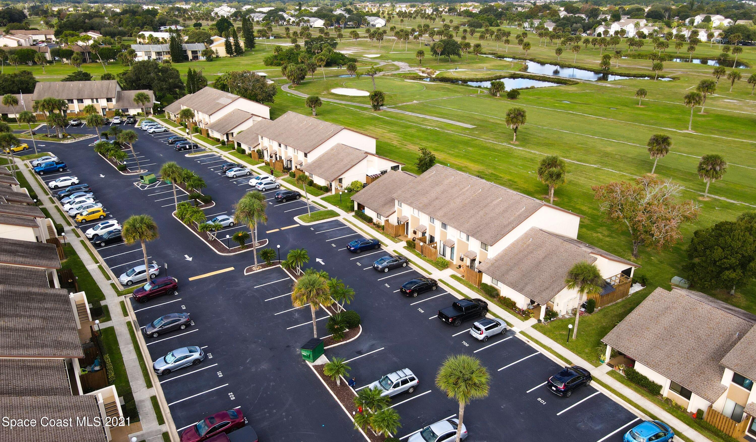 2210 Golf Isle Drive, Unit 906 Melbourne, FL 32935 - Photo 5 of 74 an aerial view of a residential building with outdoor space