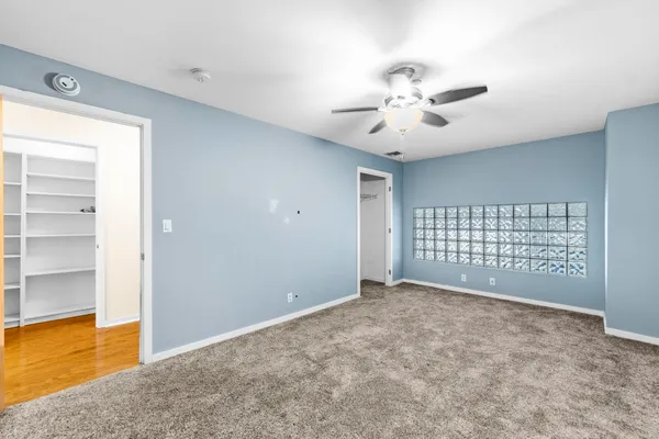 a view of an empty room with a window