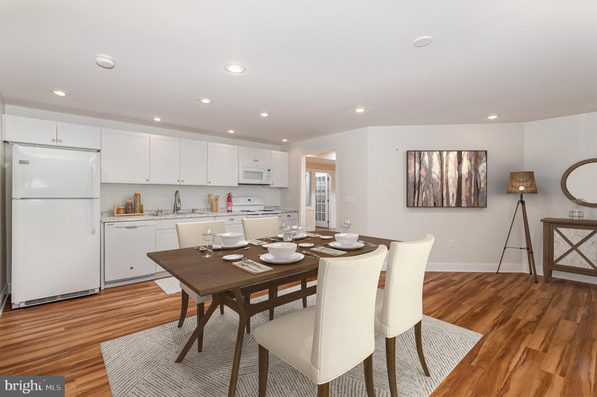 1817 Dogwood Road Harrisburg, PA 17110 - Photo 18 of 64 a kitchen with a dining table chairs and wooden floor