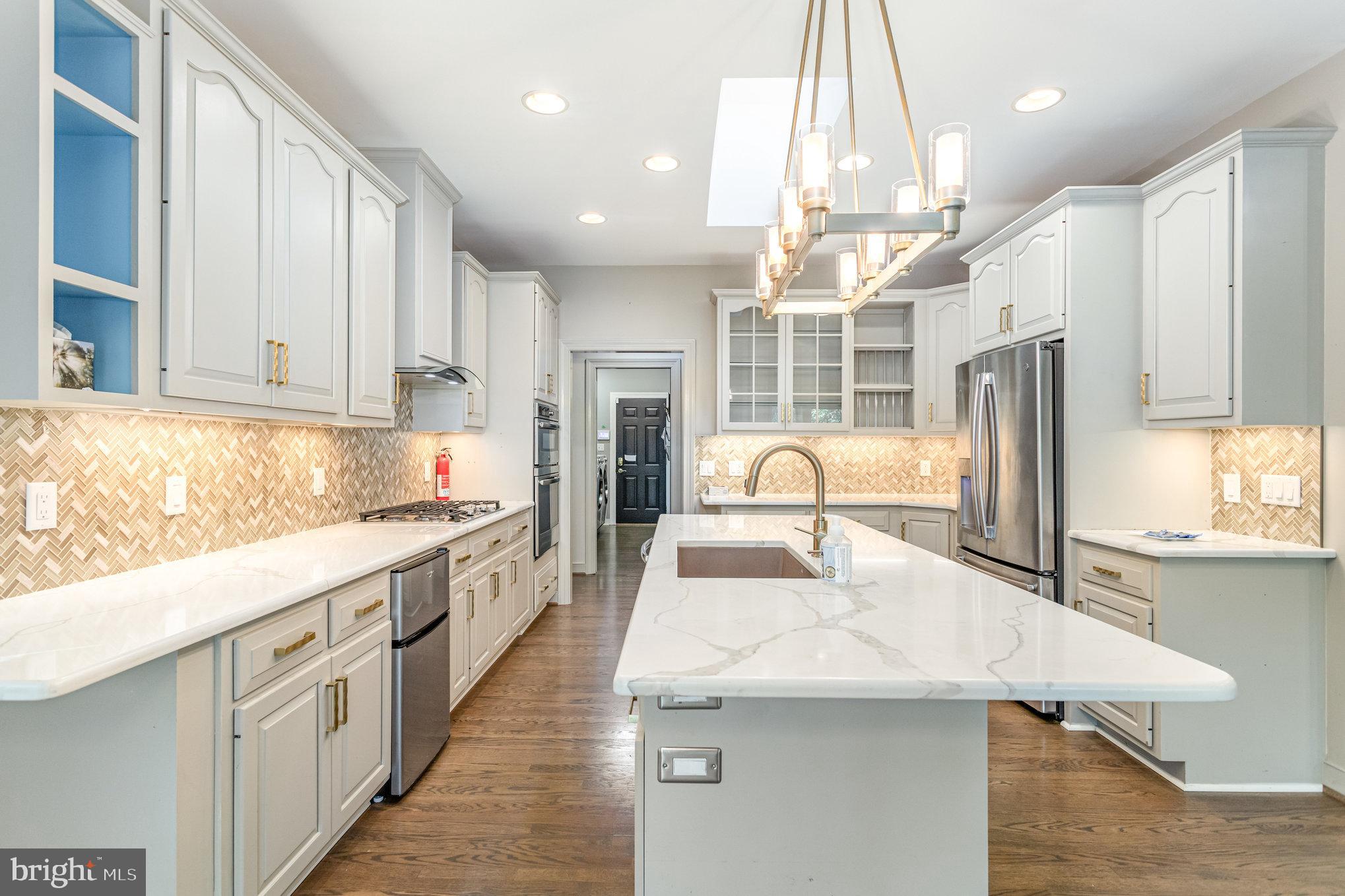 1817 Dogwood Road Harrisburg, PA 17110 - Photo 29 of 64 a large kitchen with kitchen island a large counter top space appliances and cabinets