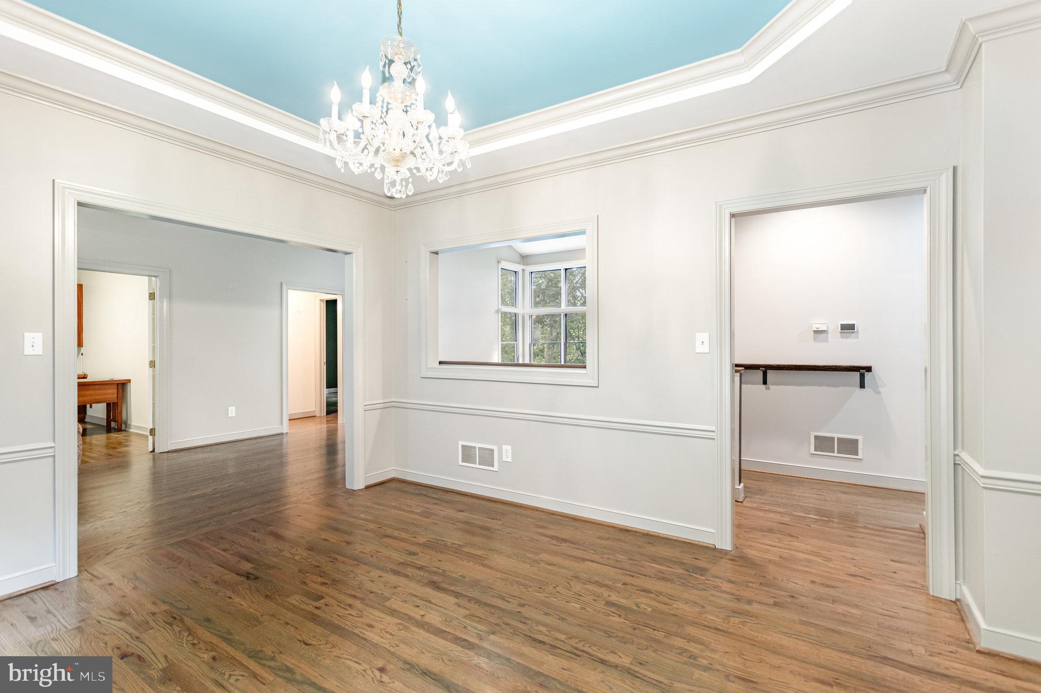 1817 Dogwood Road Harrisburg, PA 17110 - Photo 32 of 64 a view of a hallway with wooden floor and a chandelier