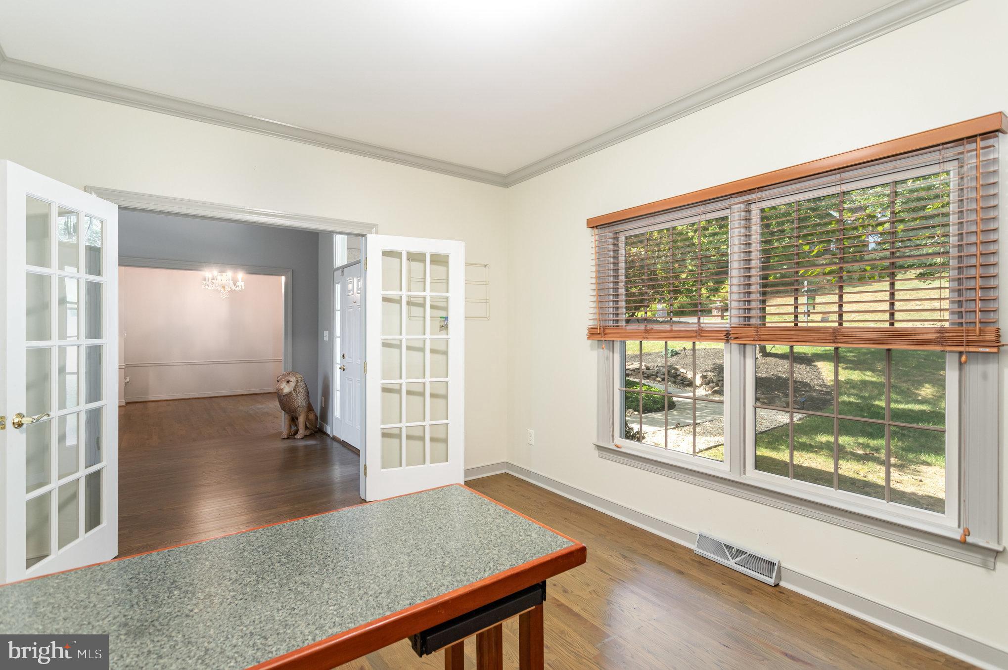 1817 Dogwood Road Harrisburg, PA 17110 - Photo 34 of 64 an empty room with floor to ceiling windows and wooden floor