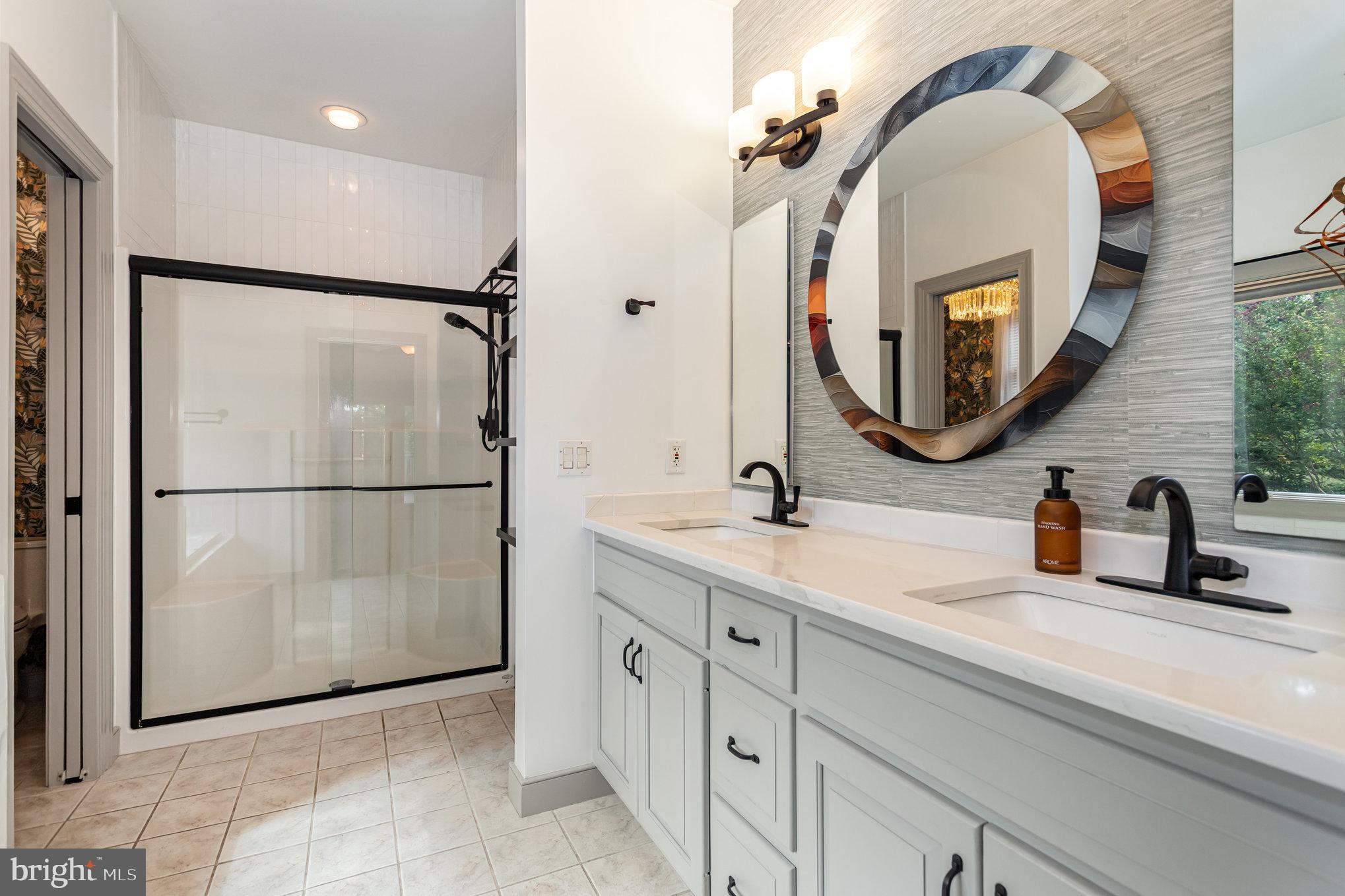 1817 Dogwood Road Harrisburg, PA 17110 - Photo 38 of 64 a bathroom with a double vanity sink and a mirror