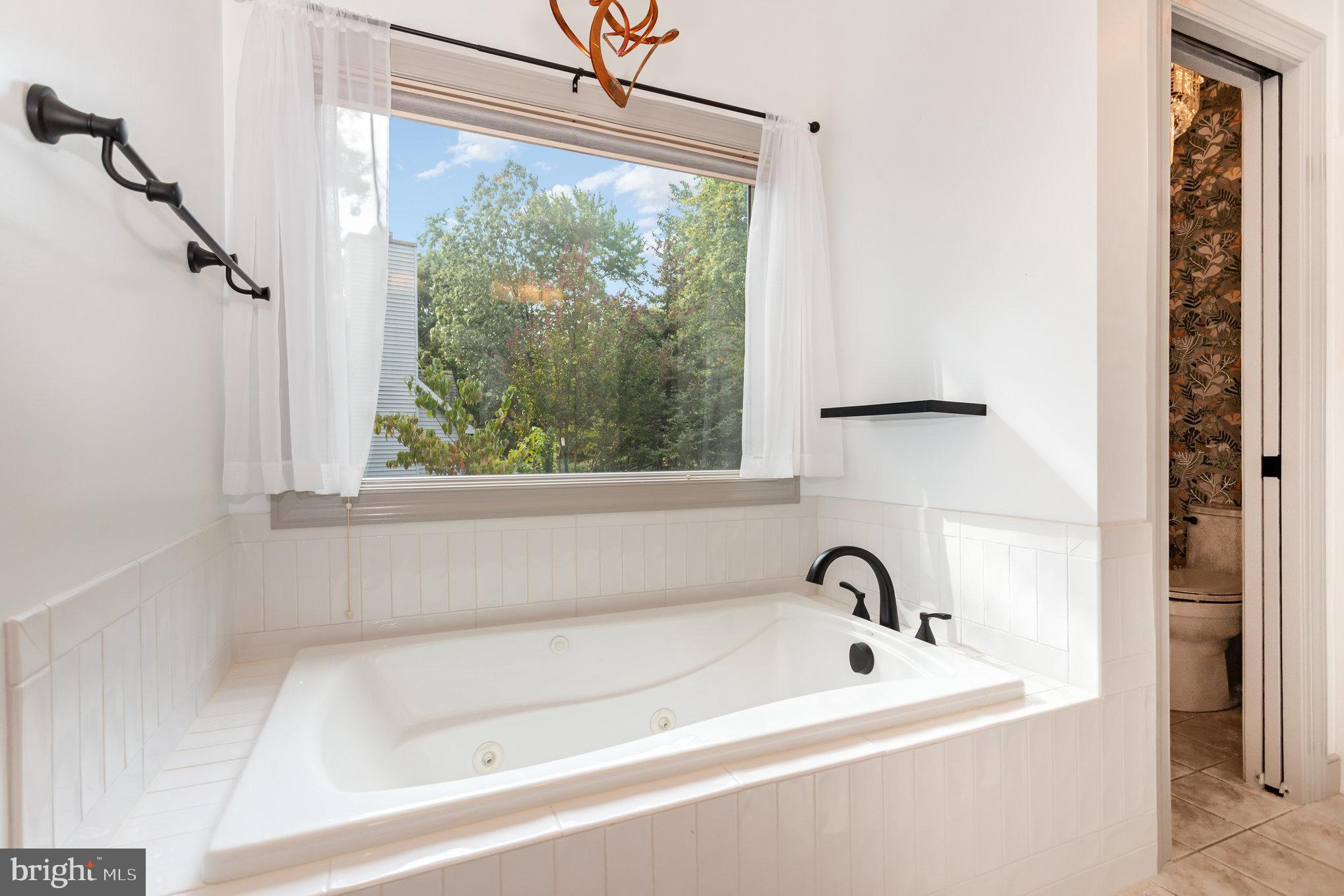 1817 Dogwood Road Harrisburg, PA 17110 - Photo 39 of 64 a white bath tub sitting next to a window