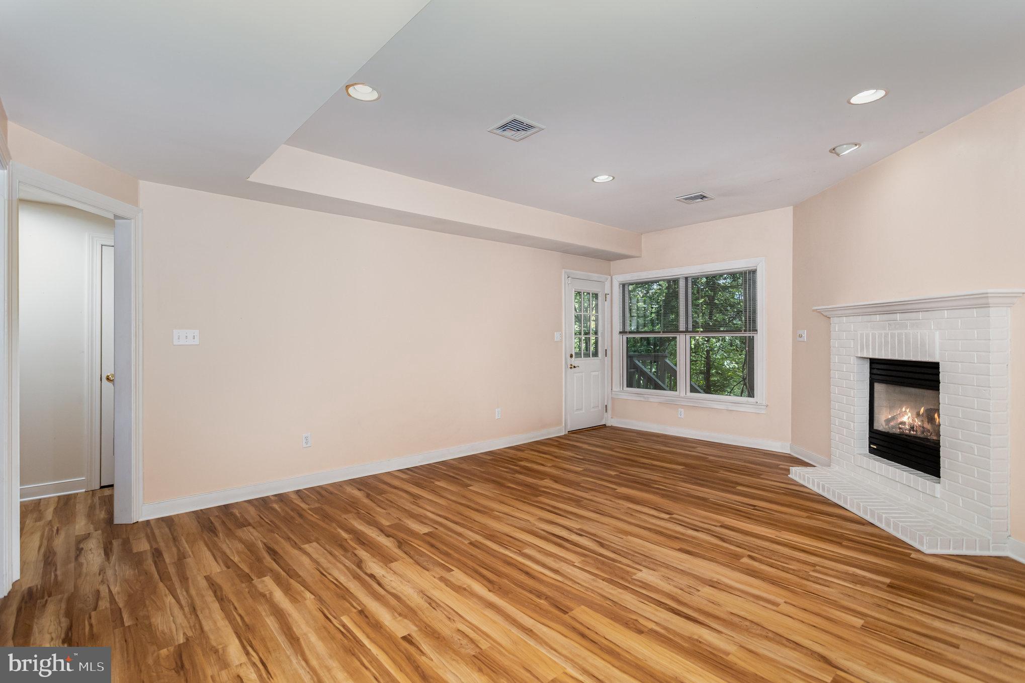 1817 Dogwood Road Harrisburg, PA 17110 - Photo 46 of 64 a view of empty room with wooden floor and fireplace