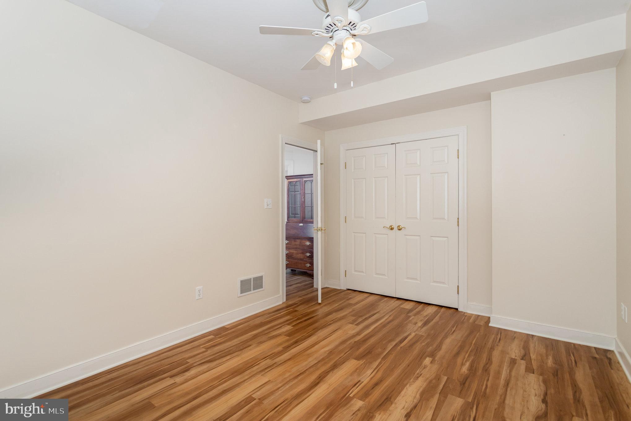 1817 Dogwood Road Harrisburg, PA 17110 - Photo 53 of 64 an empty room with wooden floor and windows