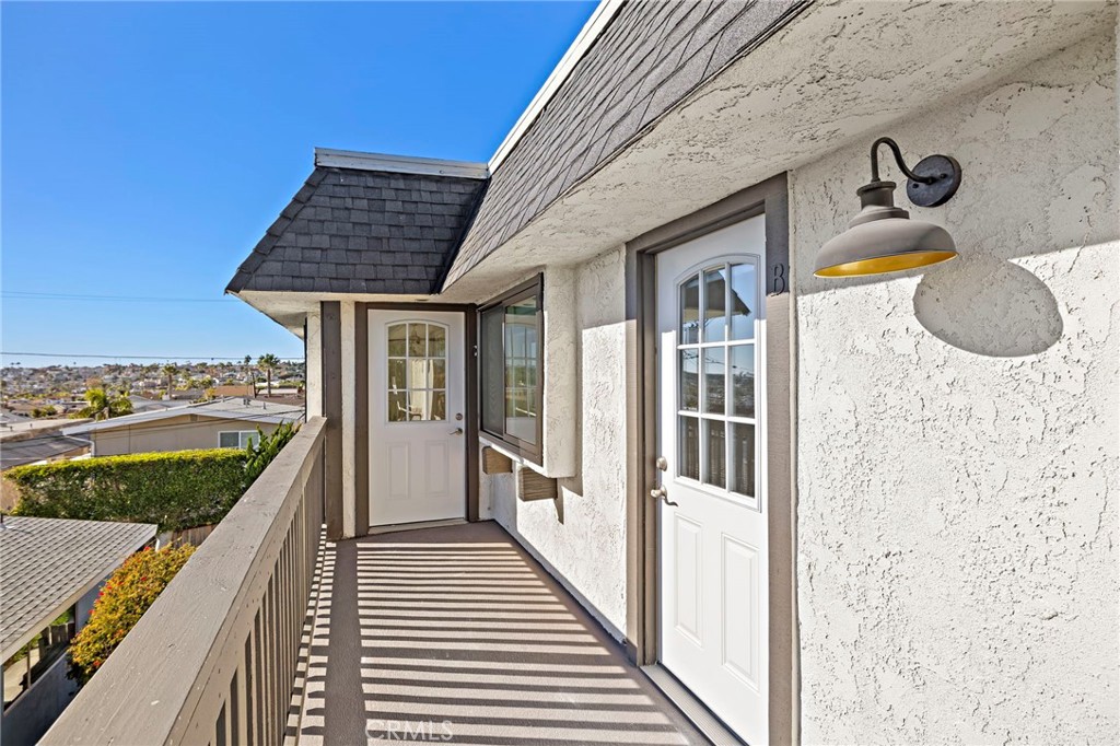 33771 Copper Lantern Street, Unit B Dana Point, CA 92629 - Photo 11 of 14 a view of balcony with wooden floor and a potted plant