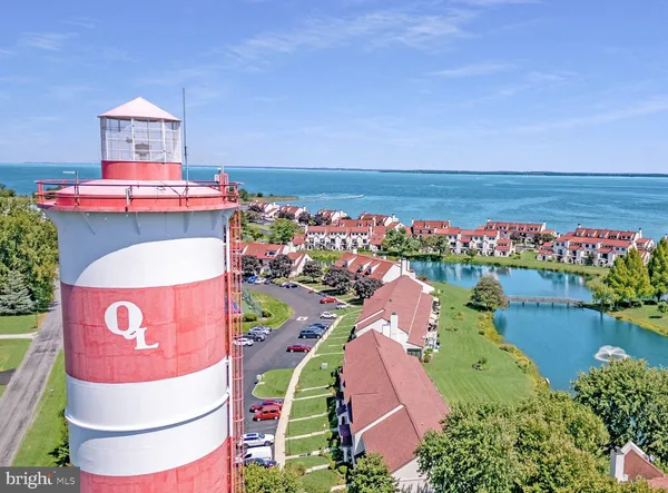 a sign board with a lake view