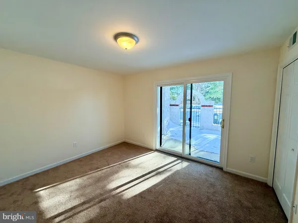 an empty room with sliding door