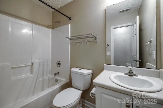 a bathroom with a sink toilet a shower and bathtub