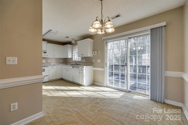 a view of a kitchen with a sink cabinets and a window