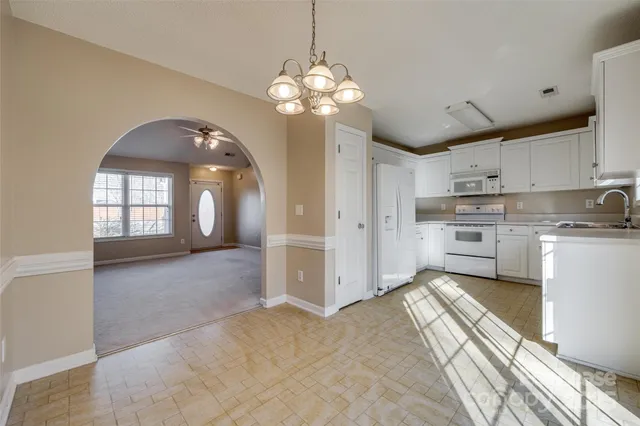 a view of a kitchen with a sink and dishwasher kitchen view