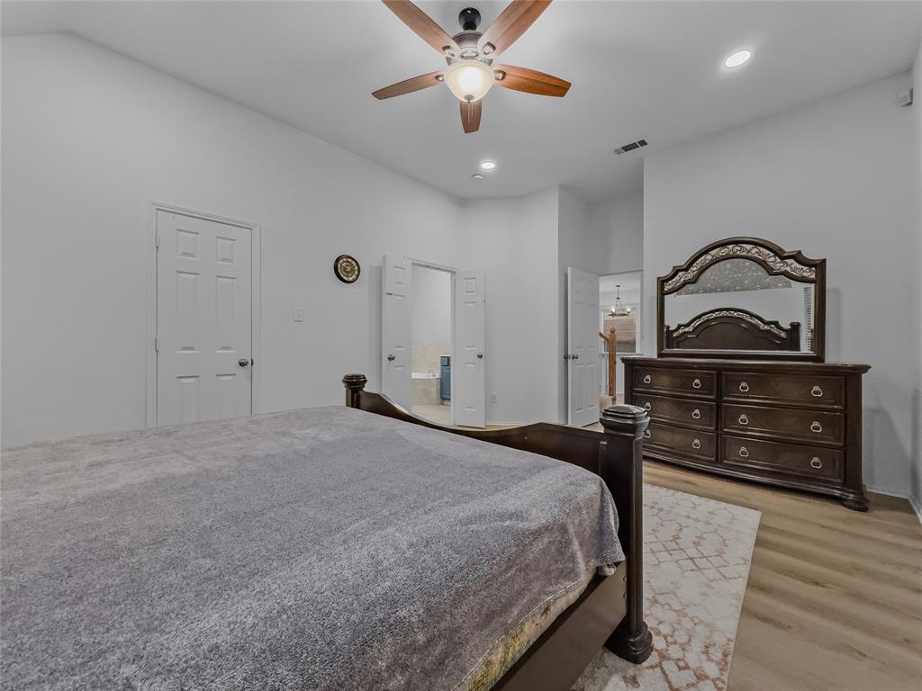 3008 Devlin Ridge Drive Plano, TX 75025 - Photo 21 of 24 Interior room featuring wood-finish flooring, a ceiling fan with integrated lighting, recessed lighting, and white paneled doors