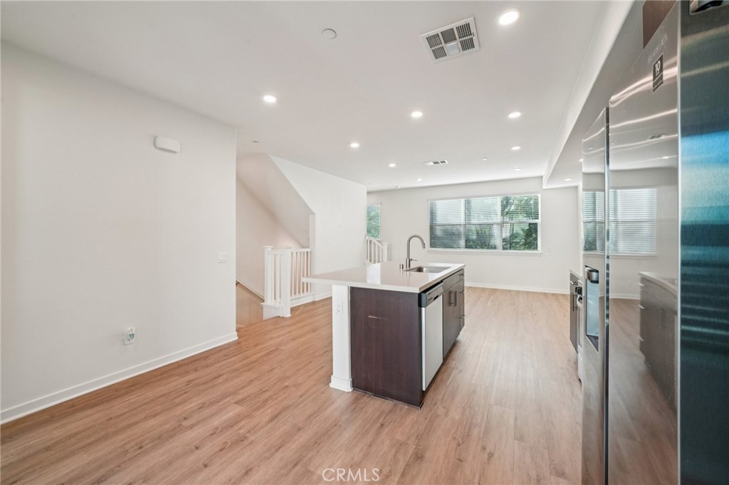 9422 Shade Place Rancho Cucamonga, CA 91730 - Photo 14 of 72 a kitchen with stainless steel appliances granite countertop a refrigerator and a sink