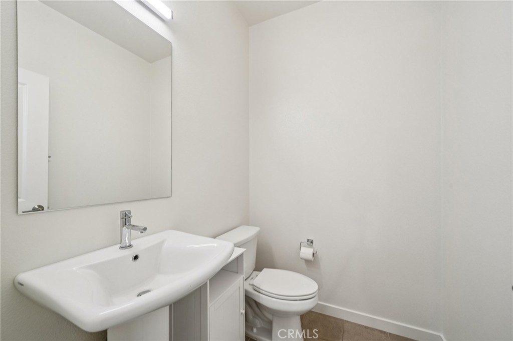 9422 Shade Place Rancho Cucamonga, CA 91730 - Photo 18 of 72 a bathroom with a sink and a toilet