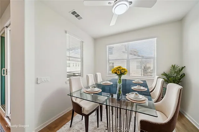 a view of an empty room with a ceiling fan