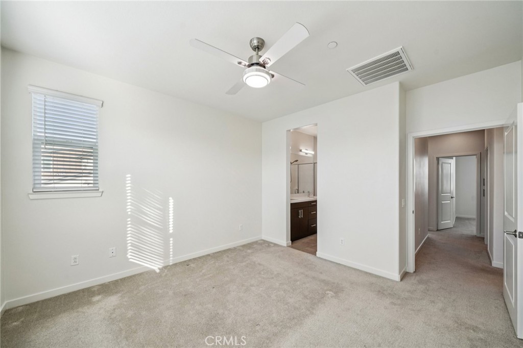 9422 Shade Place Rancho Cucamonga, CA 91730 - Photo 26 of 72 a view of an empty room with a ceiling fan