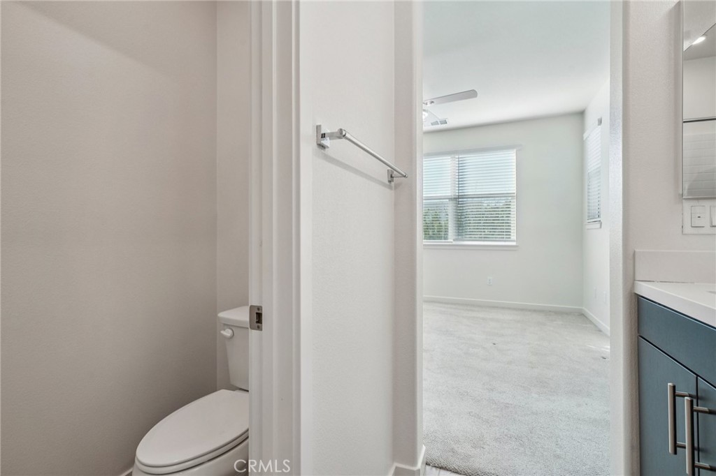 9422 Shade Place Rancho Cucamonga, CA 91730 - Photo 33 of 72 a white toilet sitting next to a bathroom sink