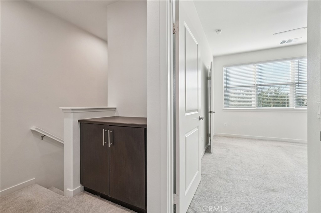 9422 Shade Place Rancho Cucamonga, CA 91730 - Photo 34 of 72 an entryway with a cabinet and a window