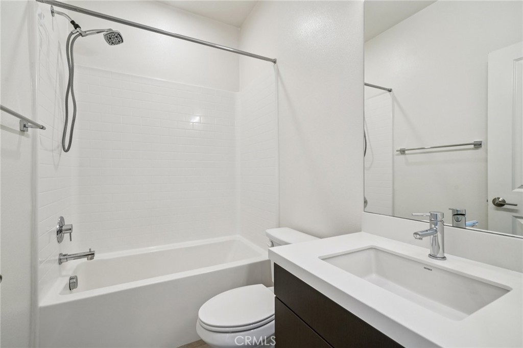 9422 Shade Place Rancho Cucamonga, CA 91730 - Photo 35 of 72 a bathroom with a sink toilet vanity and shower