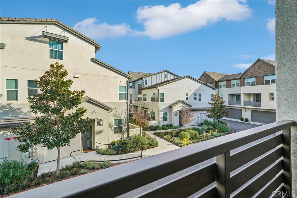 9422 Shade Place Rancho Cucamonga, CA 91730 - Photo 48 of 72 a view of a white building among the street and large trees