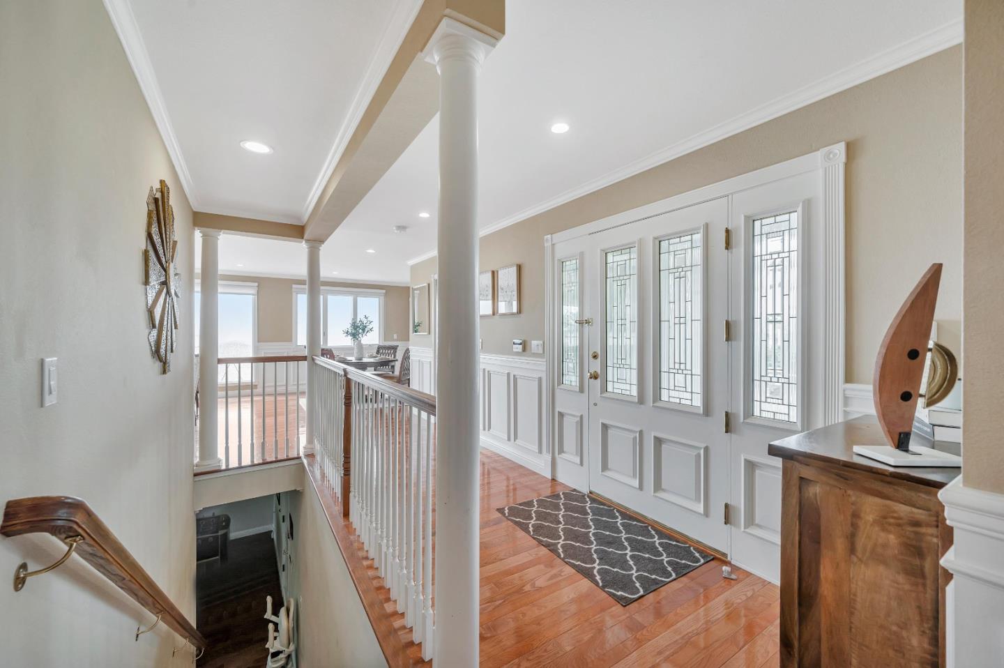 305 La Prenda Millbrae, CA 94030 - Photo 12 of 50 a view of a hallway with wooden floor and entryway
