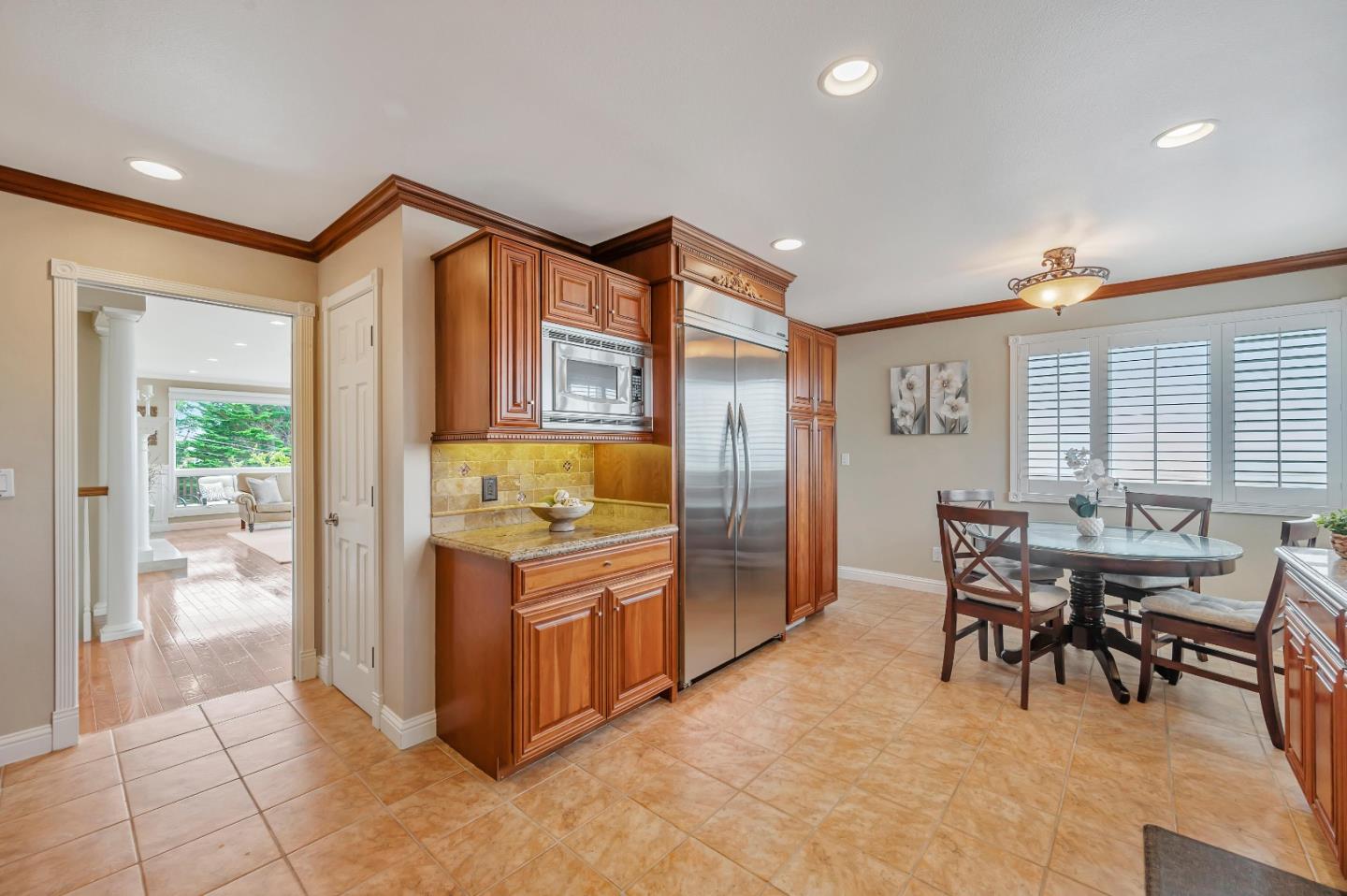 305 La Prenda Millbrae, CA 94030 - Photo 14 of 50 a dining hall with stainless steel appliances granite countertop a stove and a refrigerator