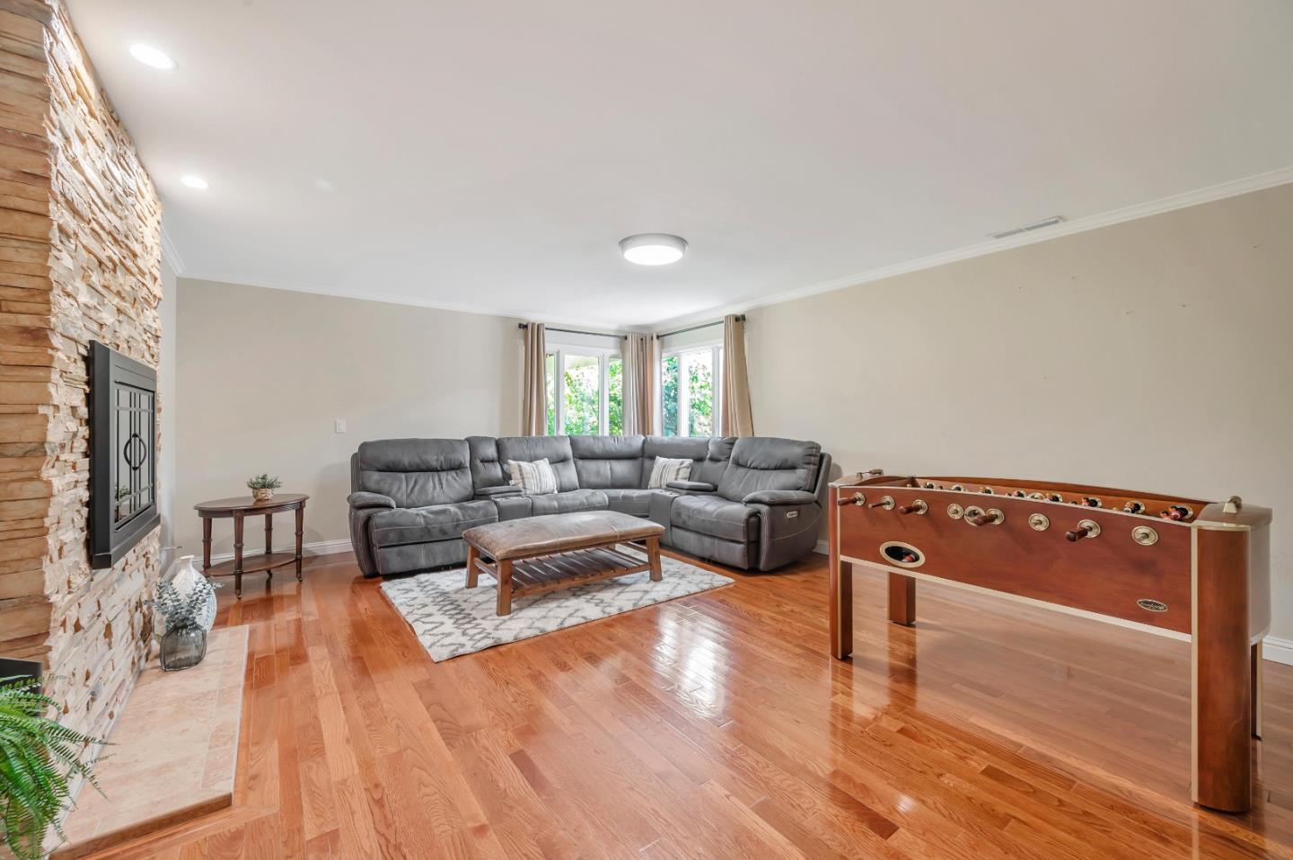 305 La Prenda Millbrae, CA 94030 - Photo 20 of 50 a living room with furniture and a wooden floor