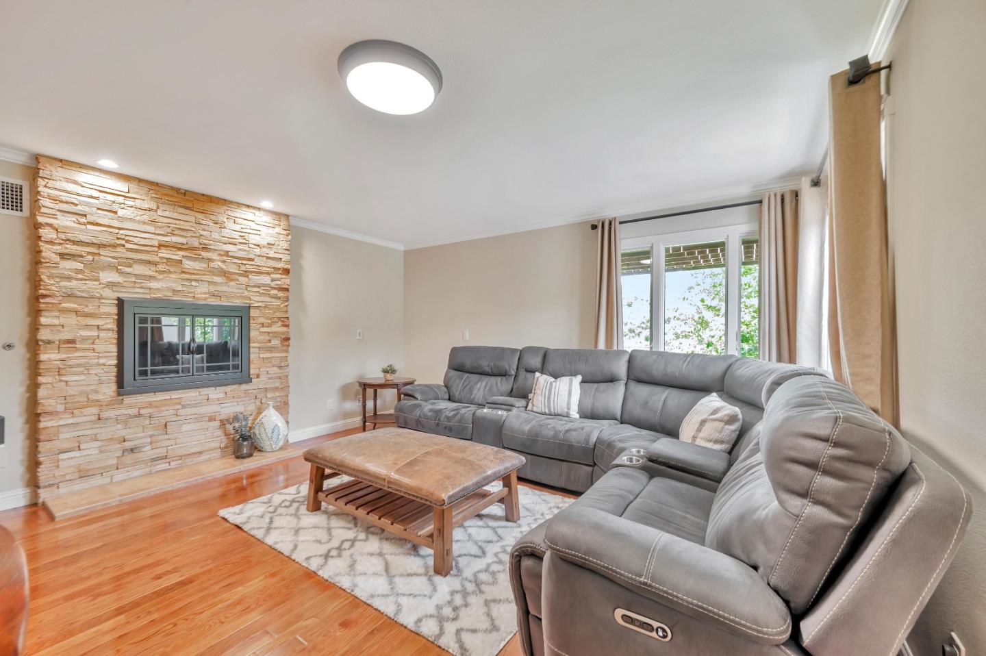 305 La Prenda Millbrae, CA 94030 - Photo 21 of 50 a living room with furniture and a flat screen tv