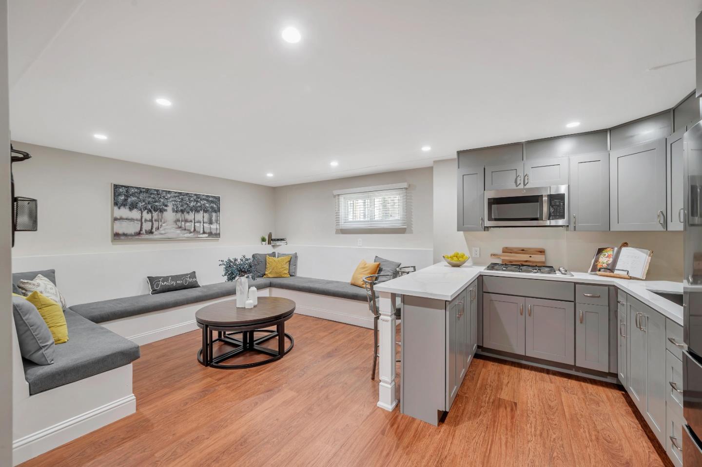 305 La Prenda Millbrae, CA 94030 - Photo 22 of 50 a living room with furniture and a wooden floor